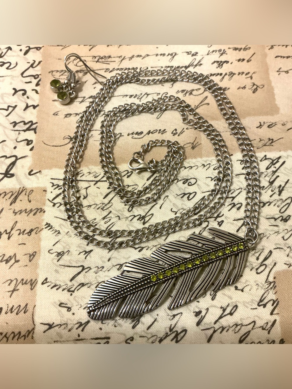 Silver Feather Pendant Necklace with Olive Green Accents -